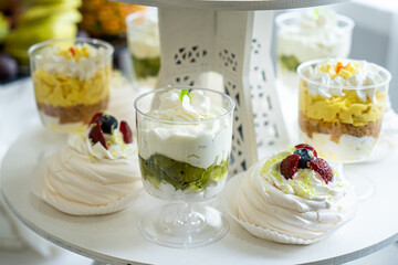 Wedding sweets, decorated tables, decorations and cupcakes, delicious meat and delicacies