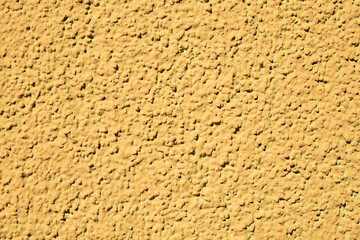Rough yellow cementitious surface. Texture surface background