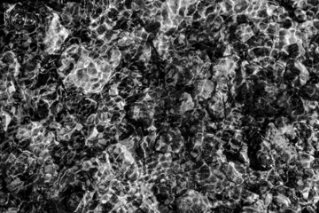 Water refracting light over stream bed