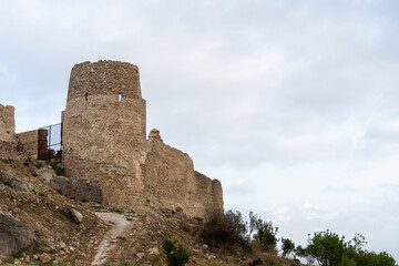 Fototapeta na wymiar Ruins of Bairén's castle in Gandia (Valencia, Spain), in an afternoon with cloudy skies.
