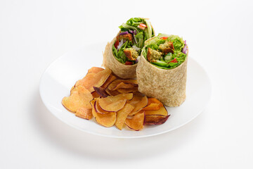 Delicious falafel and lettuce wrap with sweet potato chips, isolated