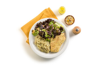 Top view of delicious chicken, potato purée and salad meal, with condiments aside, isolated