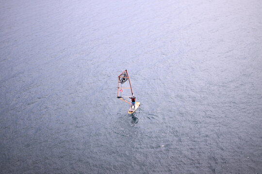 Young man doing windsurfing 