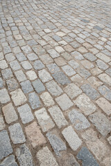 Cobblestones paving the floor of a street.