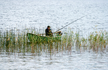Obraz na płótnie Canvas Fisherman on lake