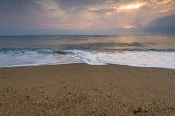 Colorful ocean beach sunrise.