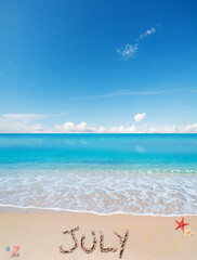 July written on a tropical beach