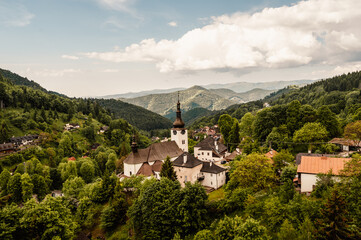 Church in The Spania Dolina village with mining landscape, Slovakia, Europe.