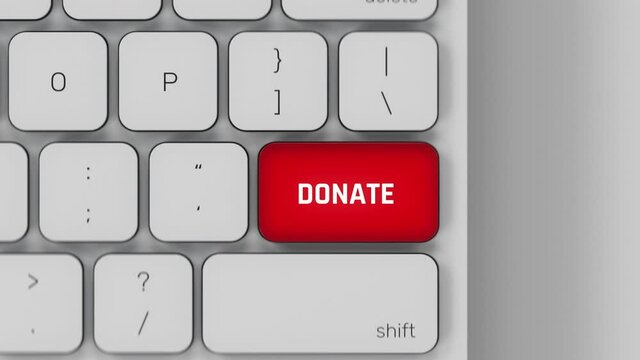 Donate red pulsing key button on white computer keyboard, charity foundation