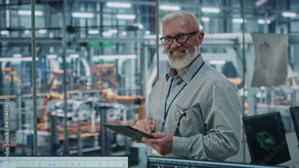 Aufkleber car factory office: portrait of senior white male chief engineer using tablet computer in automated 