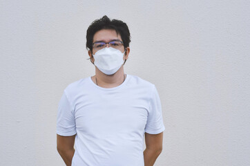 Asian men wearing mask for protect coronavirus, PM2.5 dust and air pollution  concept. - 451463244