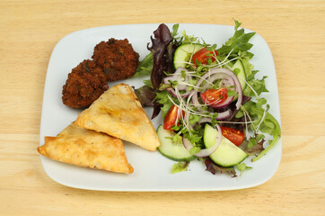 Samosa and falafel salad