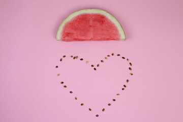 Obraz na płótnie Canvas Watermelon cloud with heart made from seeds. Love summer concept. Space for text. Love fruits