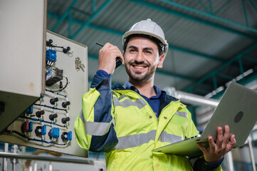 professional technician engineer working to control electrical power and safety service system,...
