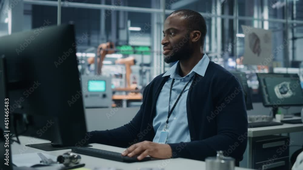 Aufkleber car factory office: portrait of confident black male chief engineer working on desktop computer. pro