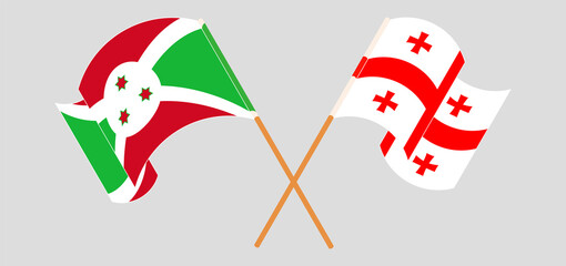 Crossed and waving flags of Burundi and Georgia