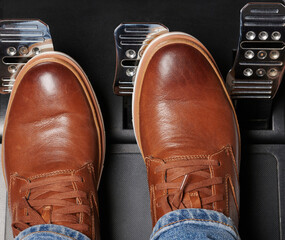 Man in casual shoes press car pedal