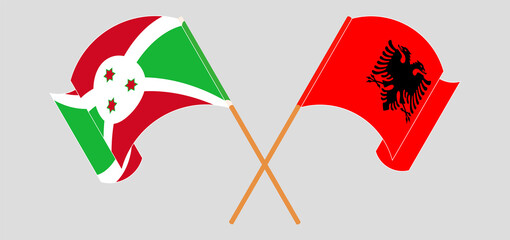 Crossed and waving flags of Burundi and Albania