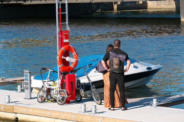 Young is standing on the pier of the yacht club.
