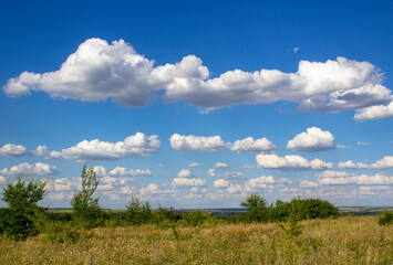 White clouds in the blue sky.