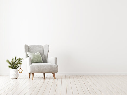 Simple and neutral minimalist Christmas interior mockup with grey armchair and fir tree branch in vase with star decoration on empty white wall background. 3d rendering, illustration.