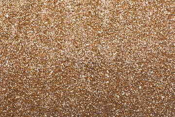 Shiny light brown glitter as background, closeup