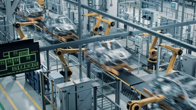 Car Factory 3D Concept: Automated Robot Arm Assembly Line Manufacturing High-Tech Green Energy Electric Vehicles. Construction, Building, Welding Industrial Production Conveyor. Fast Wide Shot

