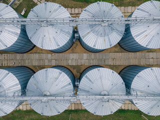 Grain storage in large silos aerial view. Silo with grain. Grain storage tank view from above
