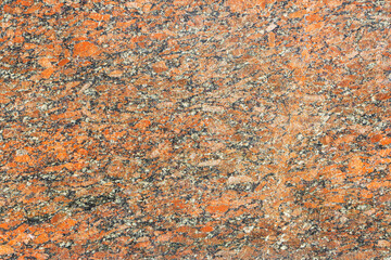The granite surface is red, as a background. Natural stone.
