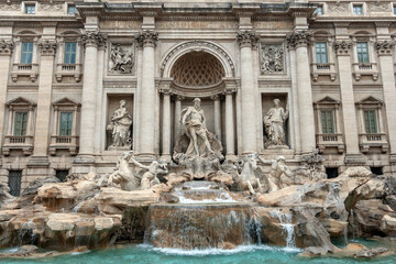 Fototapeta na wymiar The Trevi Fountain in Rome on a cloudy summer day.