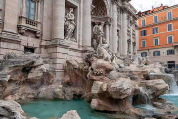 Fototapeta na wymiar The Trevi Fountain in Rome on a cloudy summer day.