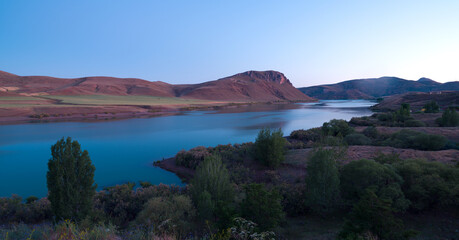 Fototapeta na wymiar Beautiful lake view at evening blue light hour