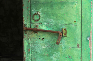 Antique open green door in a Tuscan house