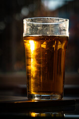 glass of beer on dark background