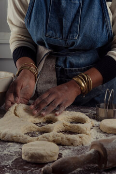 Woman making biscuits in her kitchen