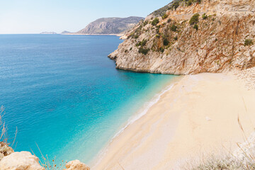 Fototapeta premium Picturesque sea bay with beautiful beach with turquoise water. Summer beach holiday background