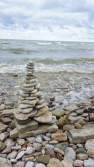 memorial cairn stones on the beach