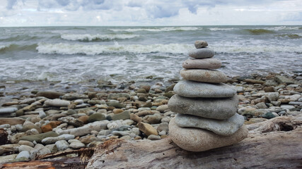 memorial cairn stones on the beach