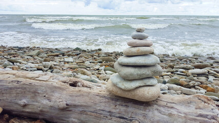 memorial cairn stones on the beach