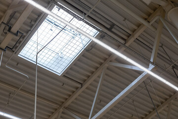 ventilation window with automatic opening in the roof of a shopping center or warehouse