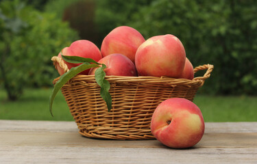 Basket of Fresh Organic Peaches on table at Market