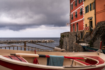 Fototapeta na wymiar the small village of Riomaggiore Italy. Fishing boat in the foreground