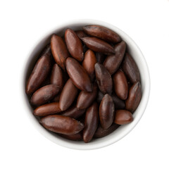 Bowl of brazilian baru nuts isolated over white background