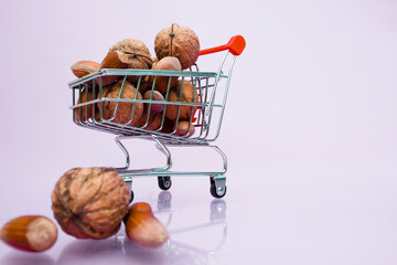 Walnut and hazelnuts in a supermarket cart. 