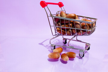 Supermarket cart filled with hazelnuts. High quality photo