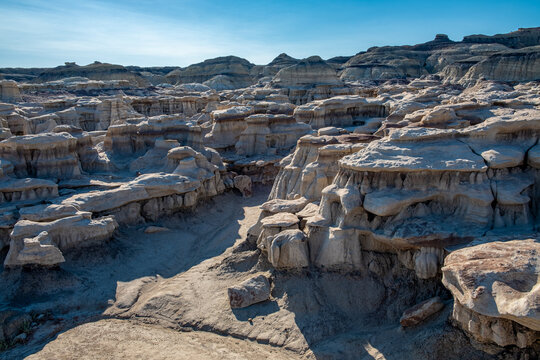 A multitude of small columns and pillars support the cap rocks of the Bisti Badlands