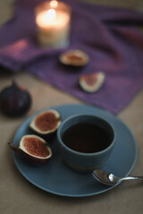 cozy composition with ripe fresh figs and textiles 
