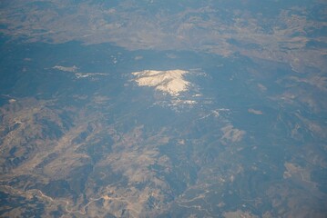 Clouds and sky as seen through window of an aircraft
