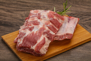 Raw pork ribs served rosemary
