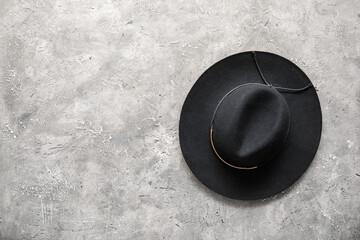 Stylish hat on grunge background